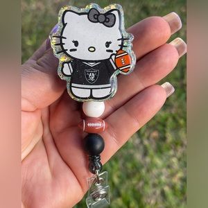 Hello Kitty Raiders custom badge reel.  Alligator clip.
